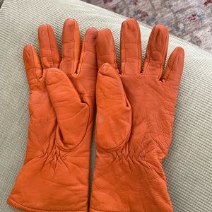 Orange leather gloves in perfect condition